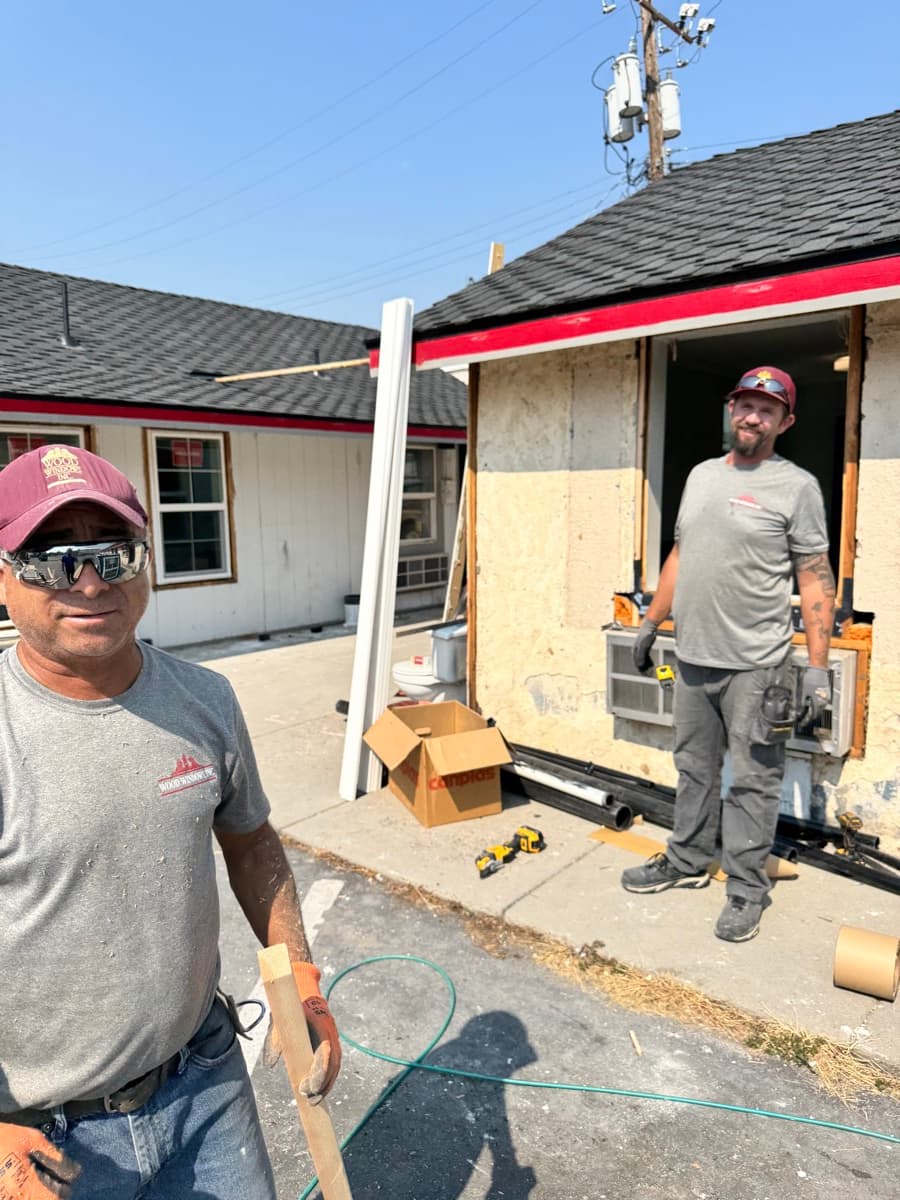 Two Wood Windows installers on a job site