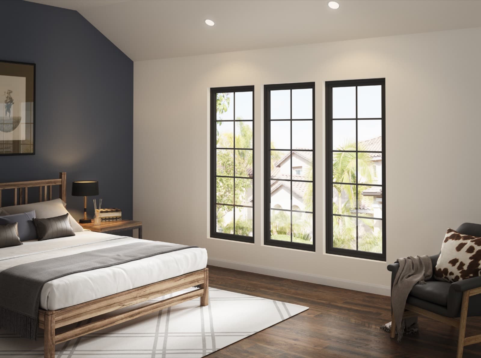 Bedroom with three black-frame Milgard Trinsic windows